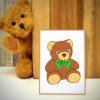 Cuddly Teddy Bear with Green Bow Tie Vector Art